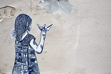 girl holding paper boat mural wall art thumbnail