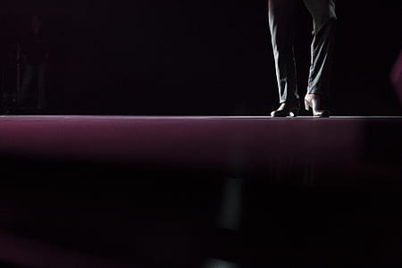 silhouette photo of person standing wearing brown leather shoes thumbnail
