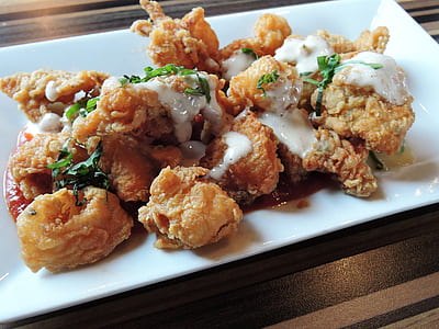 deep-fried meat topped with white sauce thumbnail