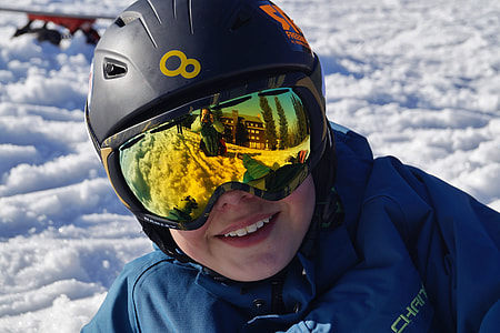 person wearing black helmet and snow goggles thumbnail