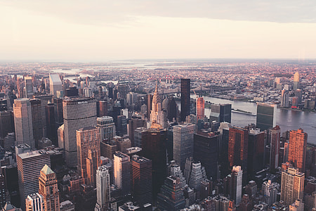 aerial photo of high-rise buildings during sun rise thumbnail