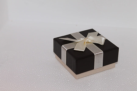 square black and brown bow accent gift box on white surface thumbnail