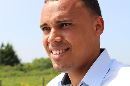 man in white collar top during daytime thumbnail