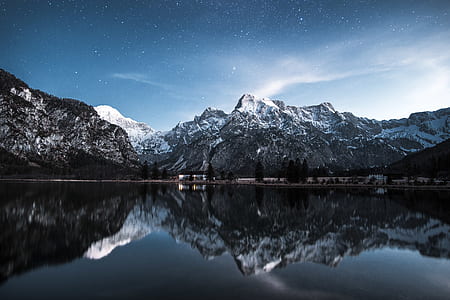 mountain reflecting on body of water thumbnail