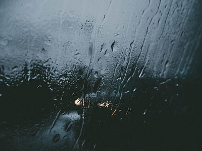 time lapse photography of water drops on glass panel thumbnail