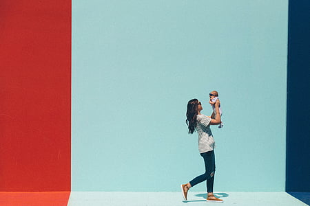 woman carrying baby thumbnail