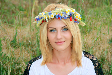 woman with floral headdress and white shirt thumbnail
