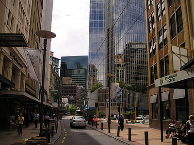 woman walking in front of building thumbnail