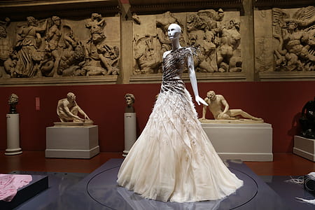 white dress worn on mannequin display in front of the museum thumbnail
