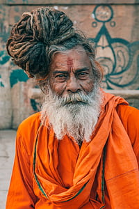 photography of man in orange robe thumbnail