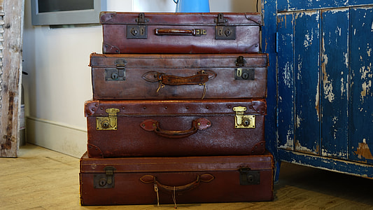 four brown rectangular suitcases thumbnail