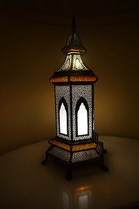 black and yellow lamp on brown wooden surface thumbnail
