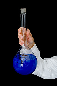 person holding filled clear glass tube thumbnail