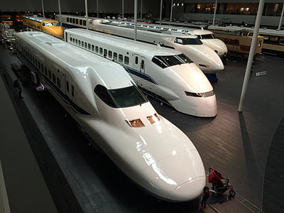 four white bullet train in station thumbnail