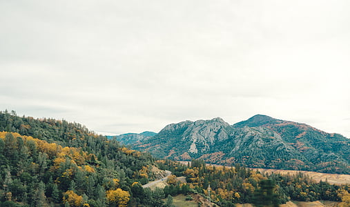 mountains under cloudy sky thumbnail