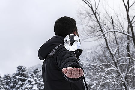 man open his palm while looking up during daytime thumbnail