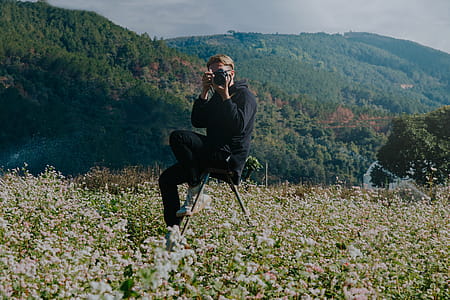Photo of Man Using Camera thumbnail