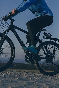 person driving bicycle at daytime thumbnail