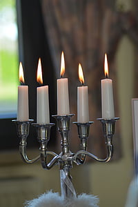 gray metal candelabra with five lit candles thumbnail