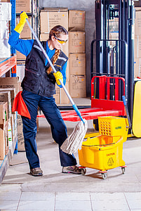 woman standing holding mop thumbnail