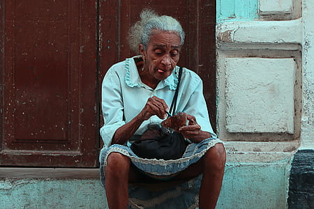 sitting woman wearing white top thumbnail