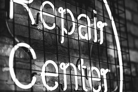 grayscale photography of Repair Center LED signage thumbnail