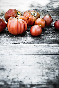 red tomatoes on wooden surface thumbnail