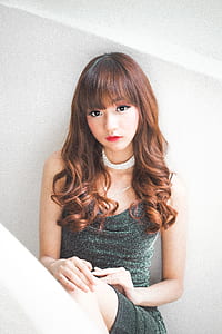 woman sitting in stair leaning on wall thumbnail