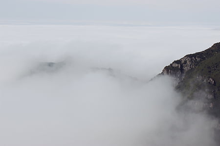 gray mountain surrounded with fogs thumbnail