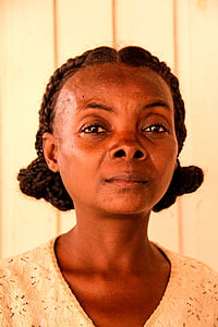 black braided-hair woman in beige top thumbnail