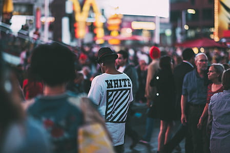 photo of group of people gathering near buildings thumbnail