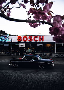black coupe beside Bosch store thumbnail