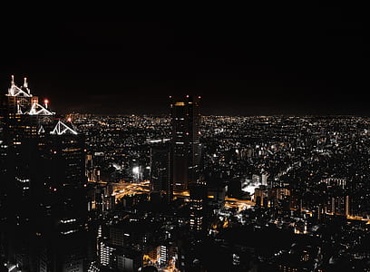 photography of city buildings during nighttime thumbnail