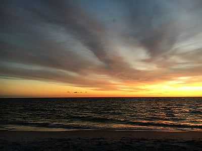 body of water during sunset thumbnail