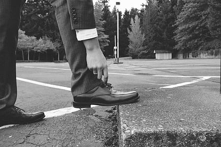 person about to touch dress shoe thumbnail