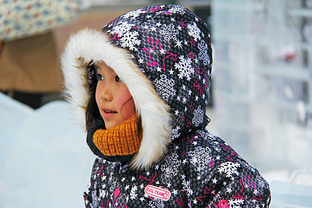 girl wearing black and red parka coat thumbnail