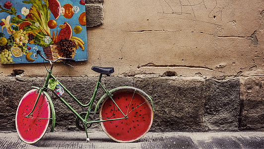 green and red bicycle on gray concrete pavement thumbnail