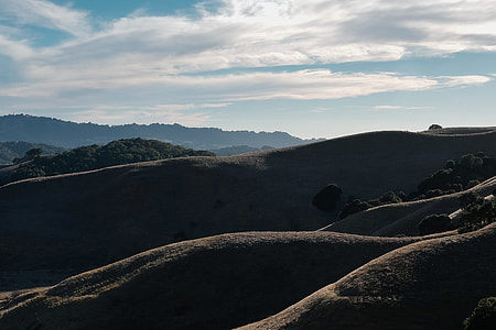 landscape photography of mountains under cirrus clouds thumbnail