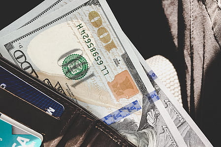 100 U.S. dollar banknote in black leather wallet thumbnail