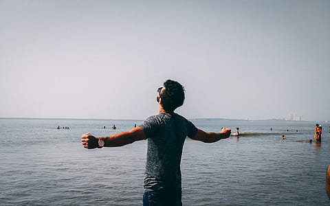 Photo of Man Wearing Gray Shirt Near Sea thumbnail
