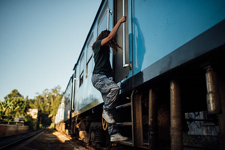 woman riding blue train thumbnail
