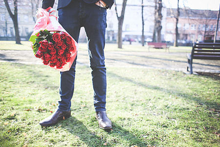 Gentleman Holding a Bouquet of Roses thumbnail