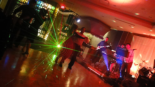 couple dancing on center floor near musicians in close room thumbnail