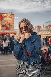 Woman Warms Up In Jean Jacket Photo thumbnail