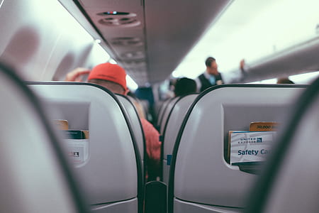 passengers sitting inside airliner thumbnail