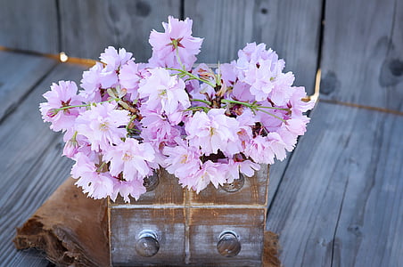 pink peach blossom flowers in brown and grey vase thumbnail