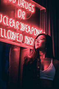 woman wearing white bra staring at LED signage thumbnail
