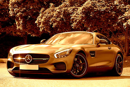 Mercedes-Benz sports car near tree sepia photography thumbnail