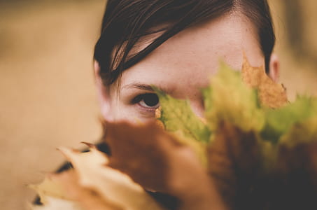 woman face covered with leaves thumbnail