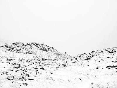 person standing on snow covered mountain thumbnail